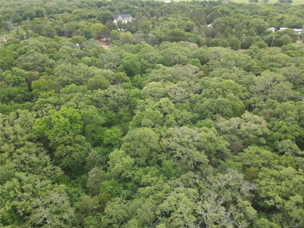 Lot 92 County Road 2255 Valley View, TX 76272 - Photo 11 of 12 an aerial view of residential houses with outdoor space and trees