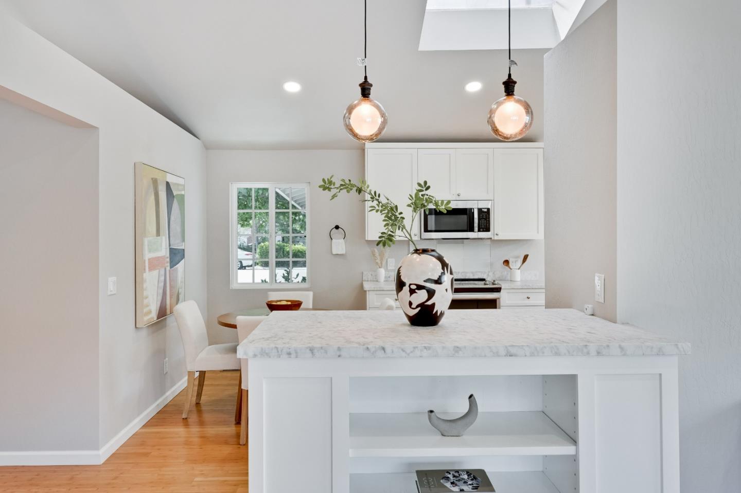 1755 Ravizza Avenue Santa Clara, CA 95051 - Photo 19 of 36 a kitchen with a sink and a chandelier