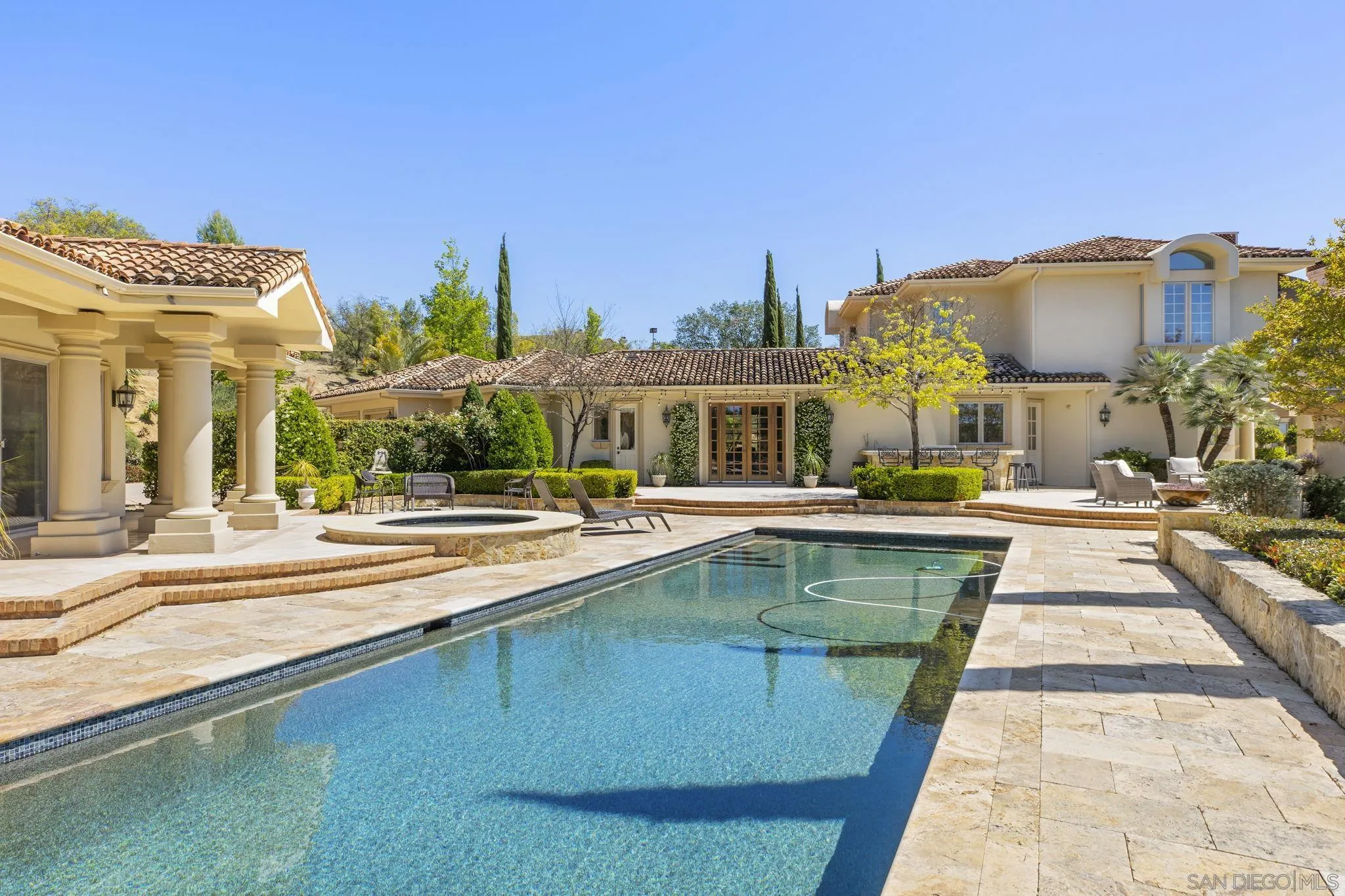 14440 Ridge Ranch Road Valley Center, CA 92082 - Photo 20 of 73 a view of a swimming pool with a lounge chairs