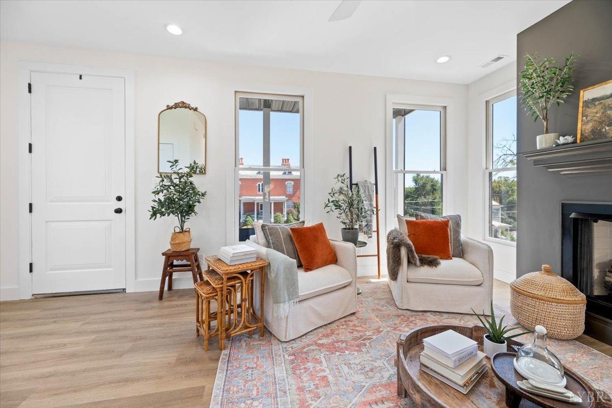 1101 Harrison Street Lynchburg, VA 24504 - Photo 12 of 66 a living room with furniture potted plant and a fireplace