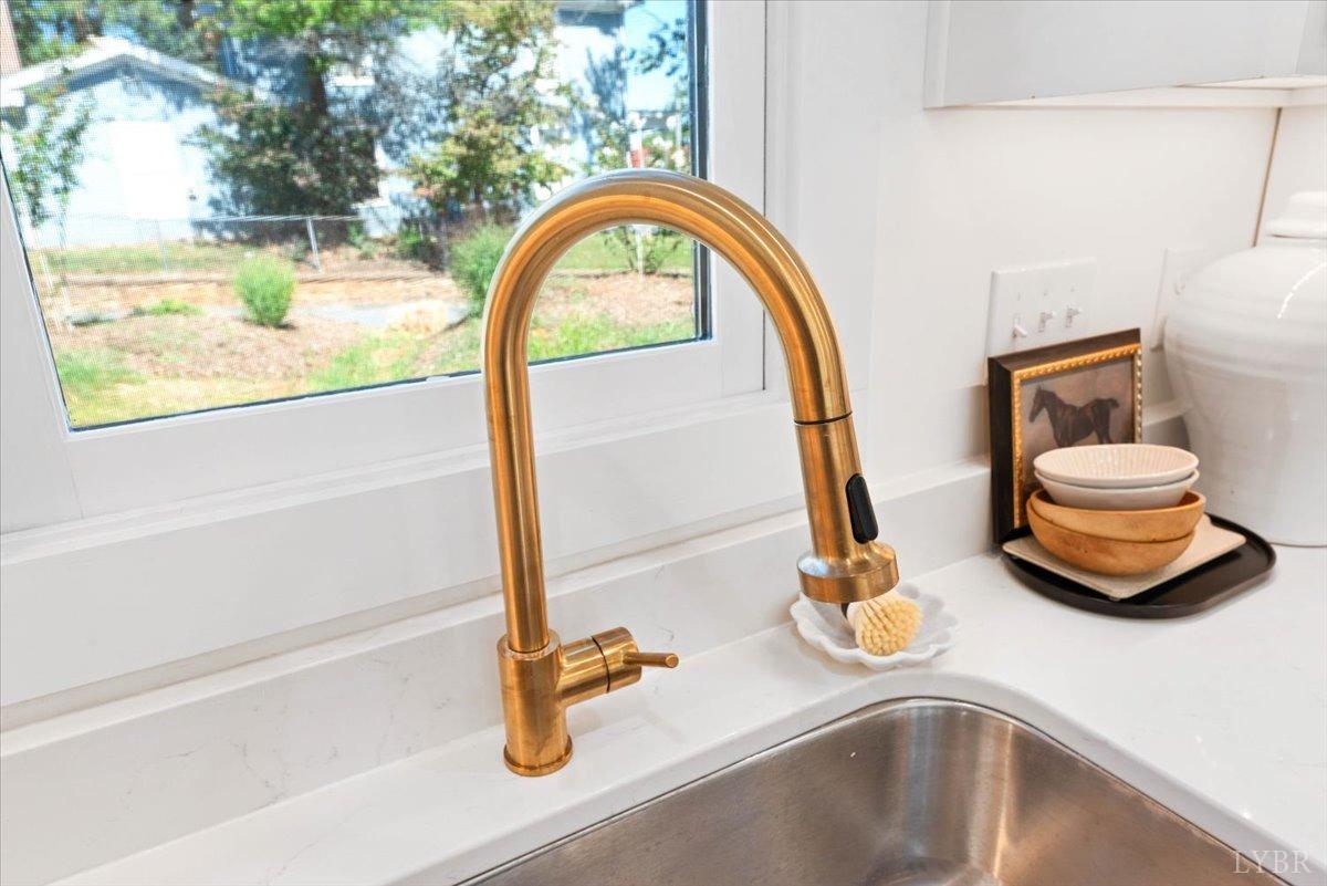 1101 Harrison Street Lynchburg, VA 24504 - Photo 19 of 66 a bathroom with a sink and a mirror