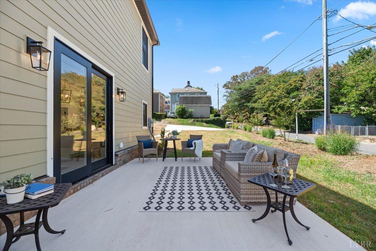 1101 Harrison Street Lynchburg, VA 24504 - Photo 30 of 66 a view of a patio with table and chairs and potted plants