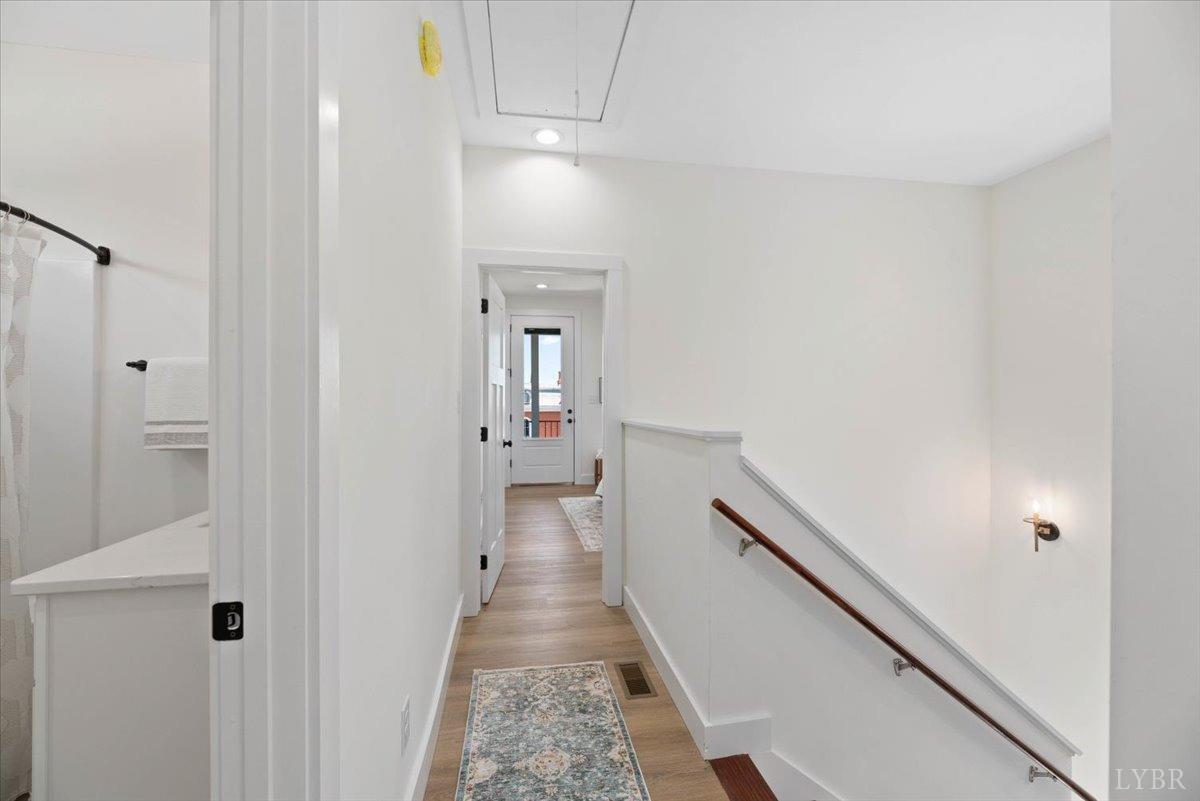 1101 Harrison Street Lynchburg, VA 24504 - Photo 33 of 66 a view of a hallway with wooden floor and staircase