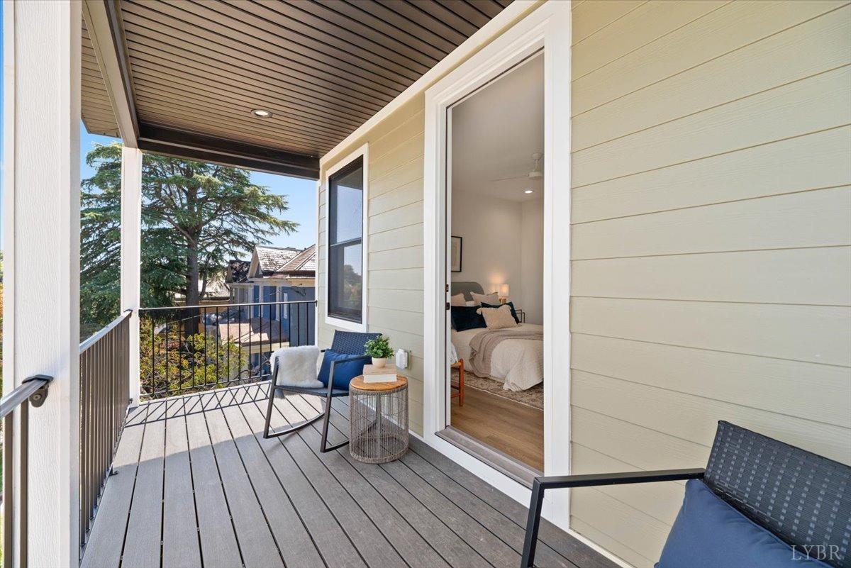 1101 Harrison Street Lynchburg, VA 24504 - Photo 41 of 66 a balcony with furniture and wooden floor