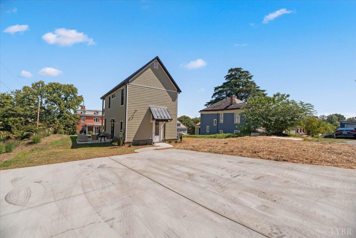1101 Harrison Street Lynchburg, VA 24504 - Photo 59 of 66 a front view of a house with a yard and garage