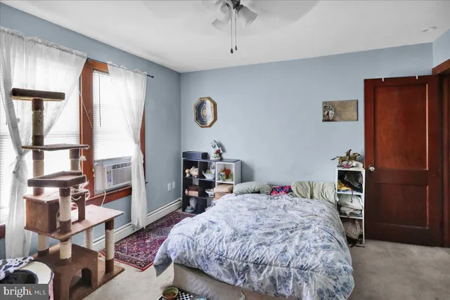 a room that has a bed and a chair in it