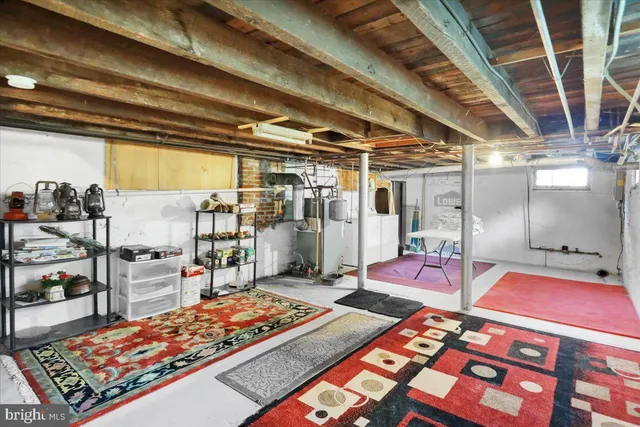 a room with lots of appliances and cabinets