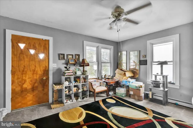 a room with lots of furniture and a chandelier