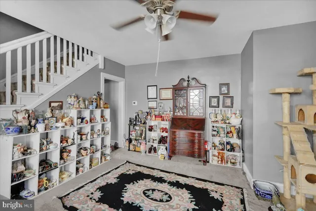 a view of a livingroom with furniture and workspace