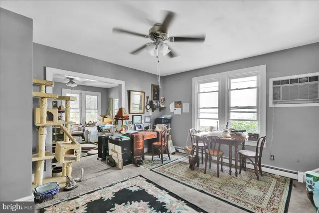 a view of a livingroom with furniture window and wooden floor