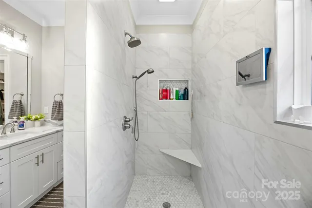 a bathroom with a bathtub sink vanity and mirror