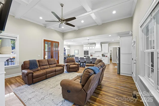 a living room with furniture a large window