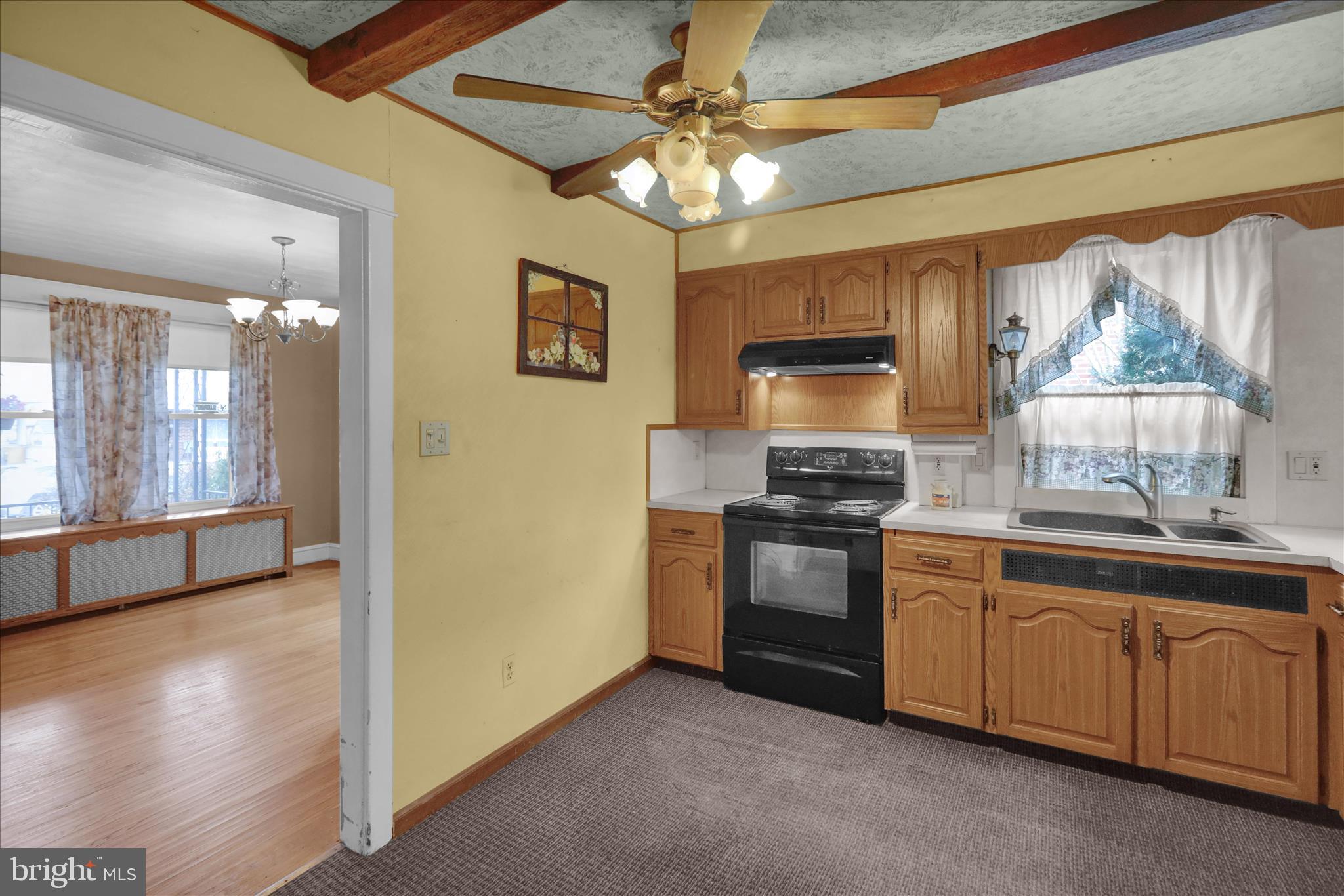 1522 Delaware Avenue Reading, PA 19610 - Photo 13 of 39 a kitchen with stainless steel appliances granite countertop a stove a sink and a refrigerator