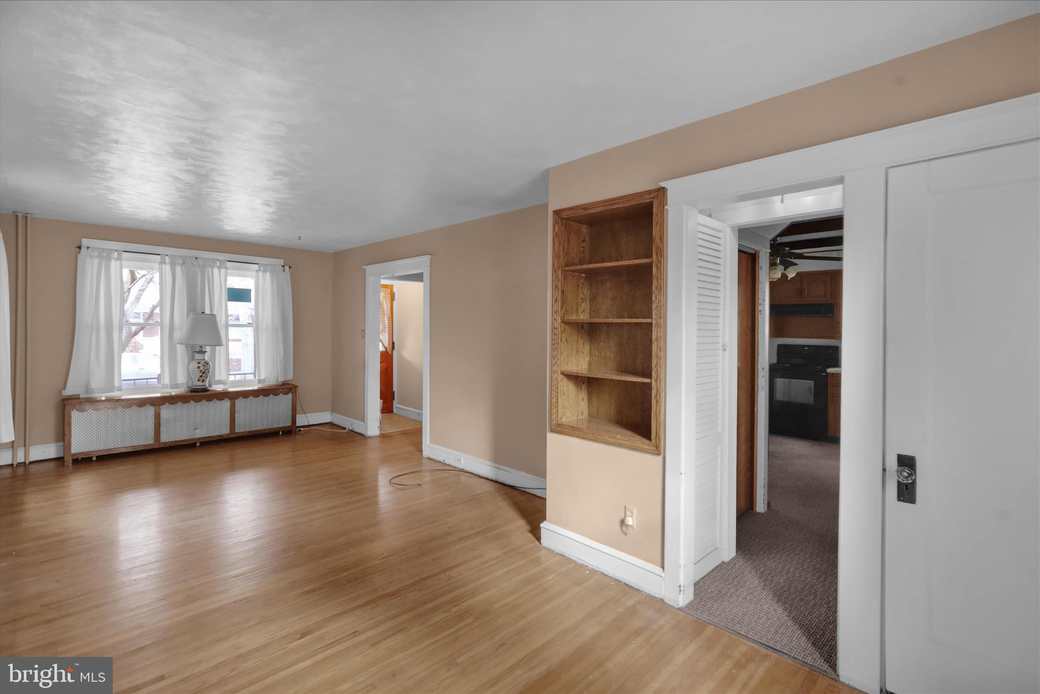 1522 Delaware Avenue Reading, PA 19610 - Photo 15 of 39 an empty room with wooden floor and windows