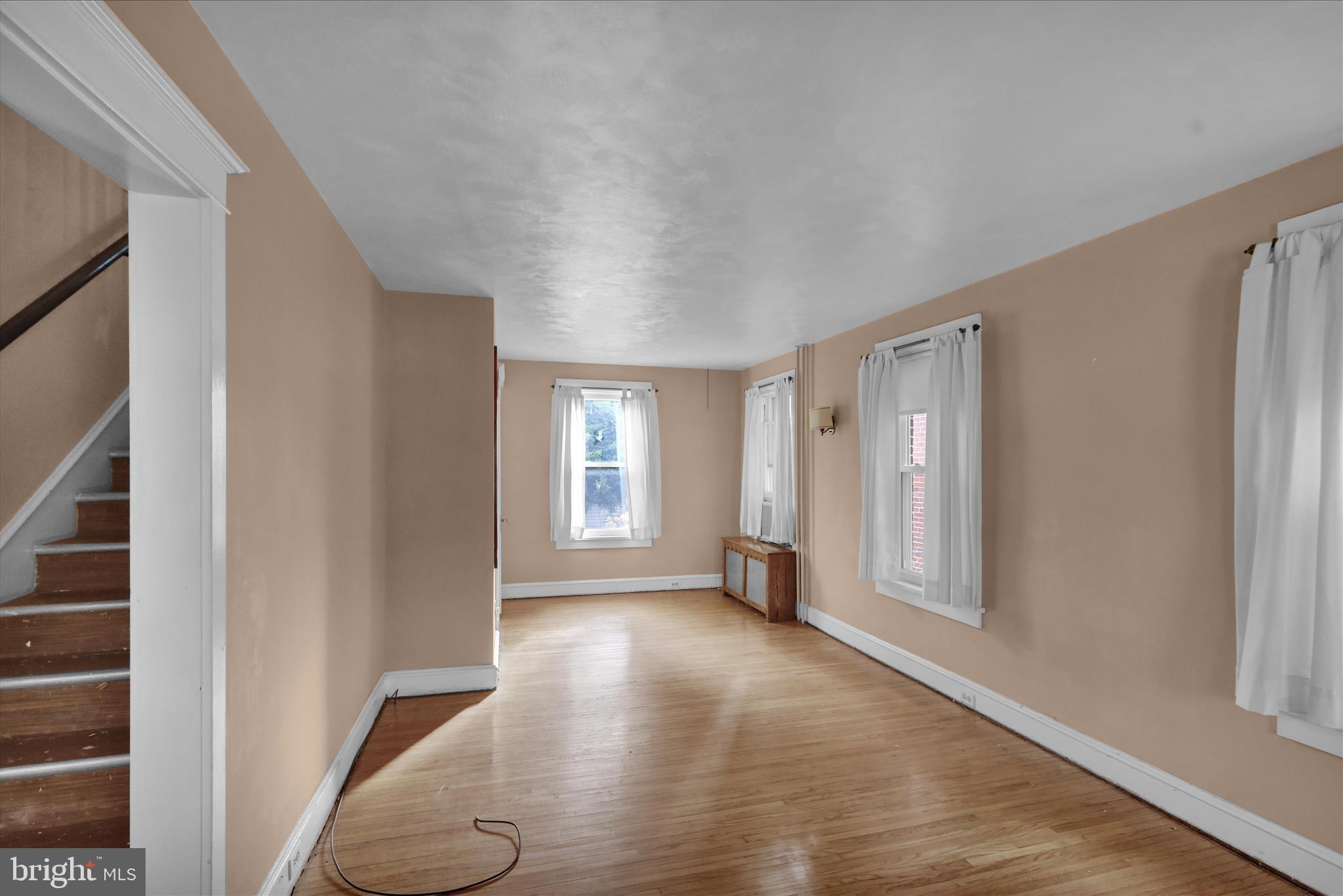 1522 Delaware Avenue Reading, PA 19610 - Photo 17 of 39 wooden floor in an empty room with a window