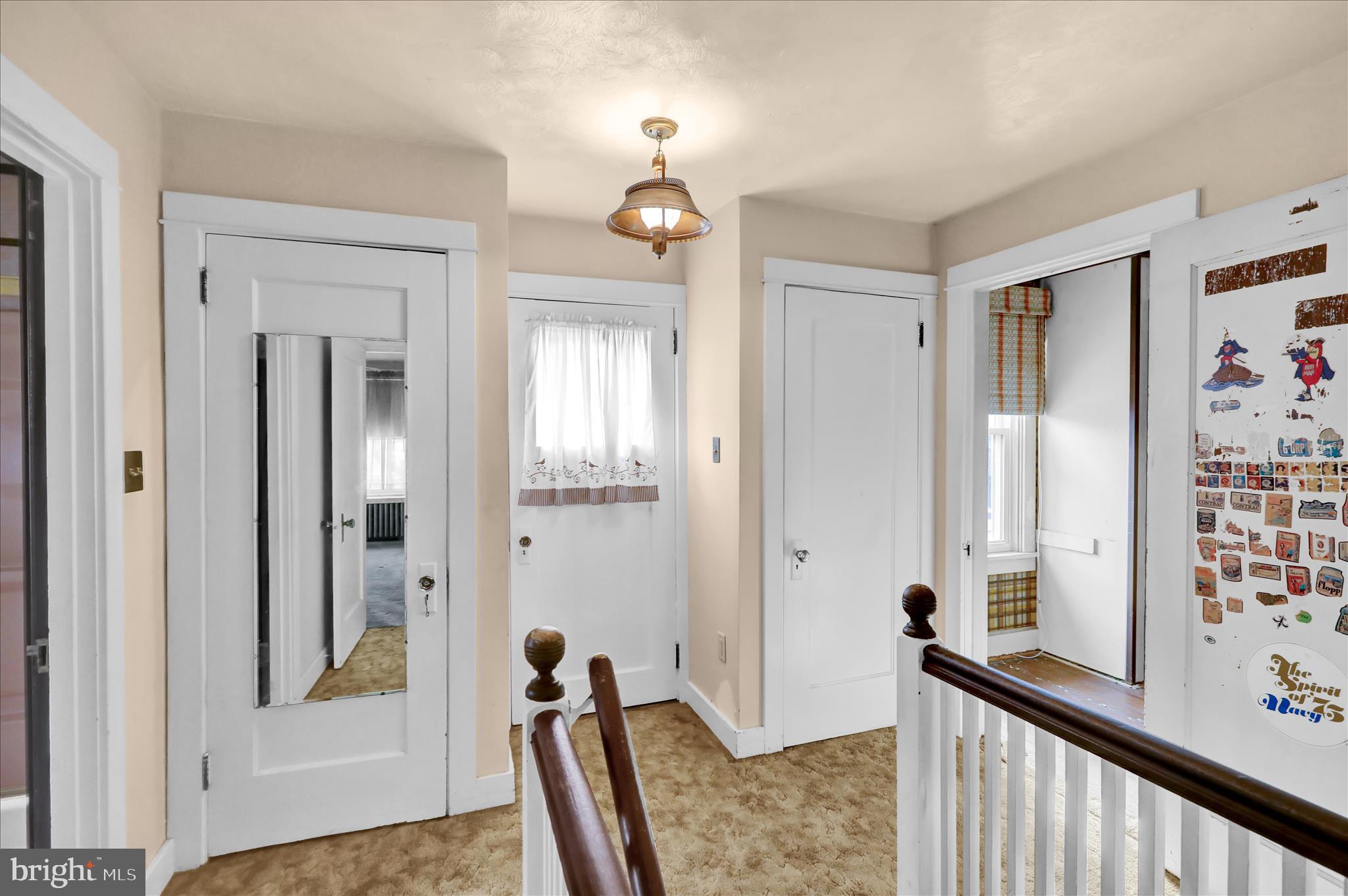 1522 Delaware Avenue Reading, PA 19610 - Photo 18 of 39 a view of a hallway with a livingroom and windows