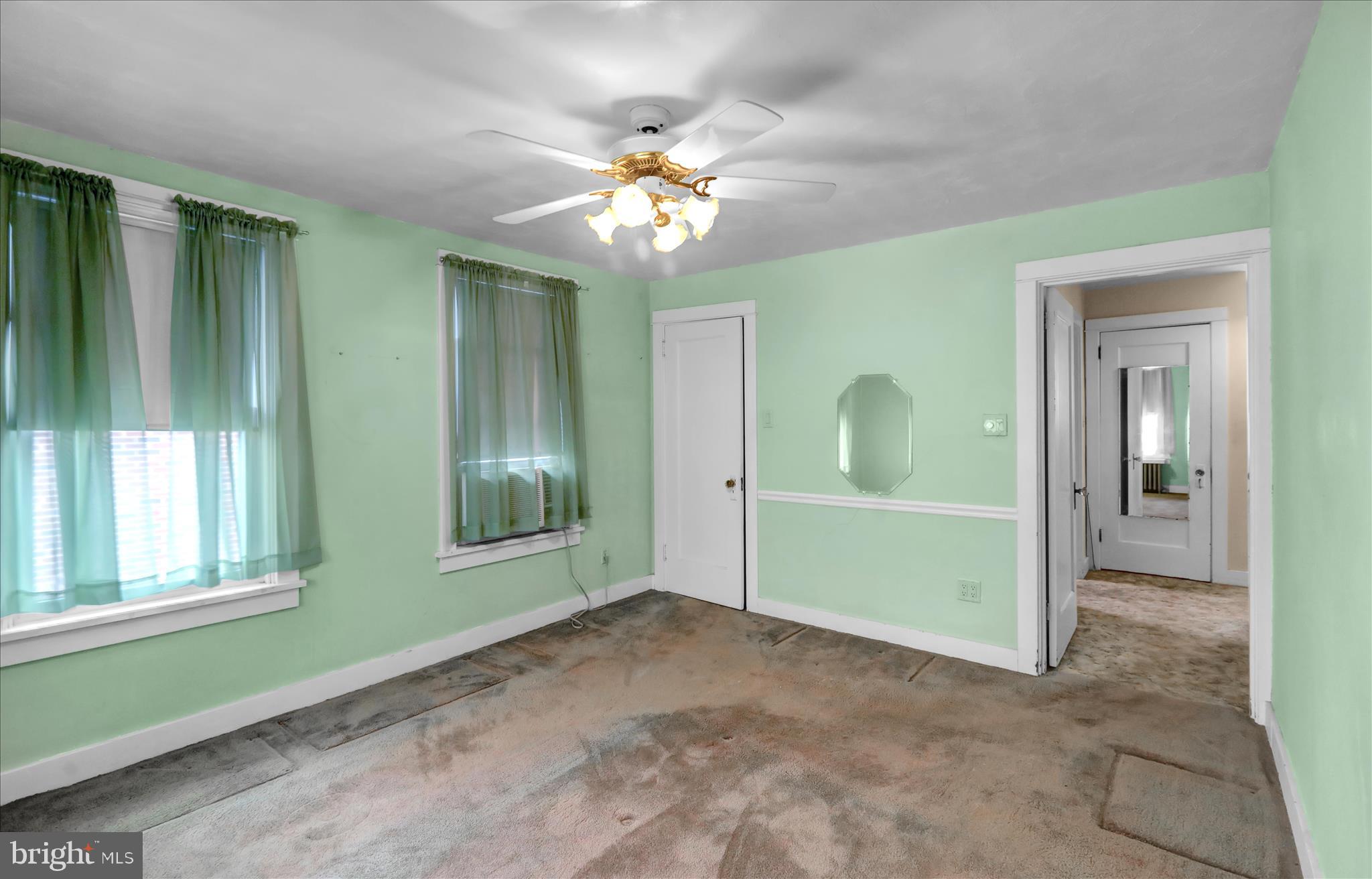 1522 Delaware Avenue Reading, PA 19610 - Photo 21 of 39 a view of an empty room with window and chandelier fan