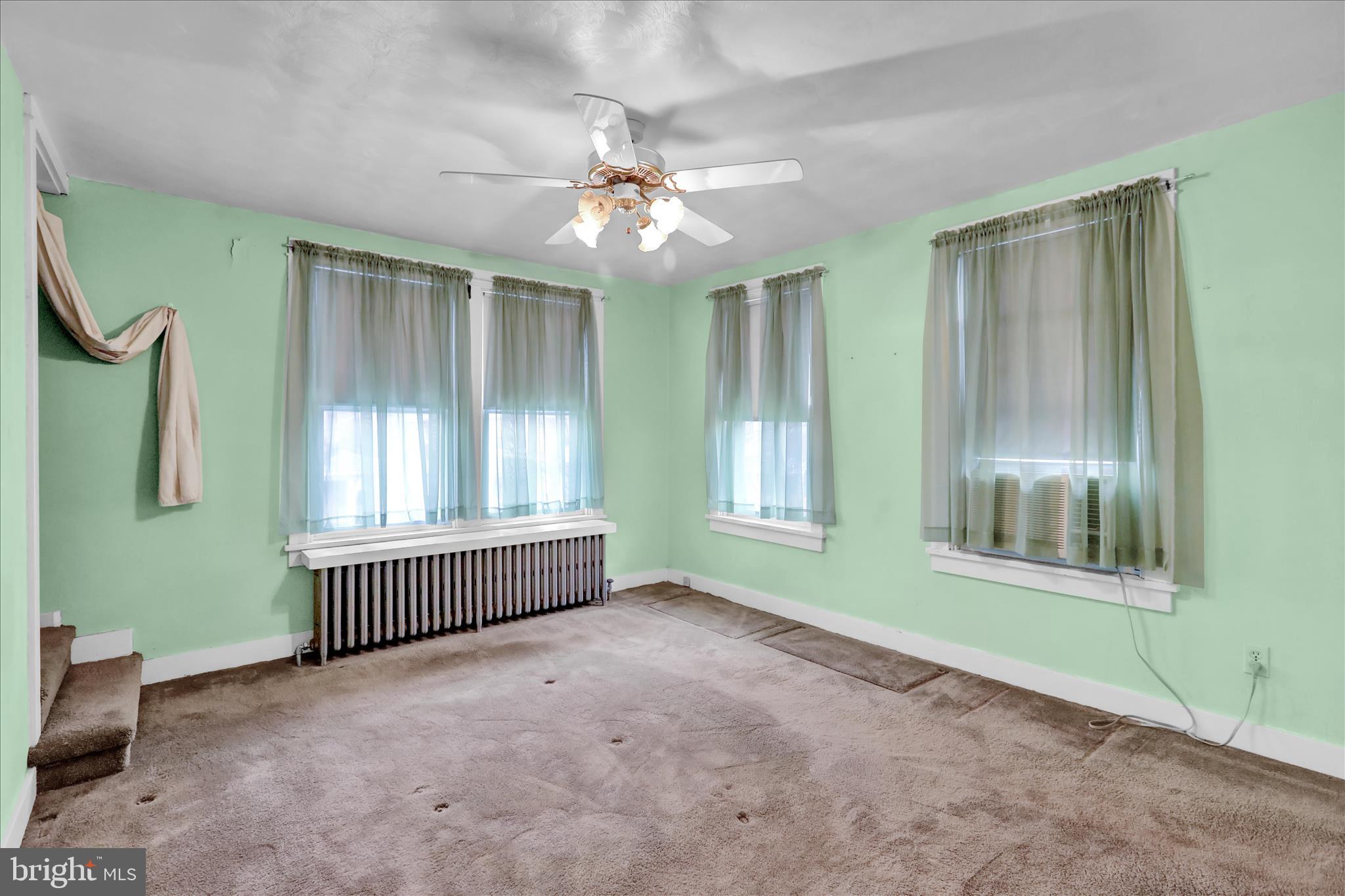 1522 Delaware Avenue Reading, PA 19610 - Photo 22 of 39 an empty room with windows and fan