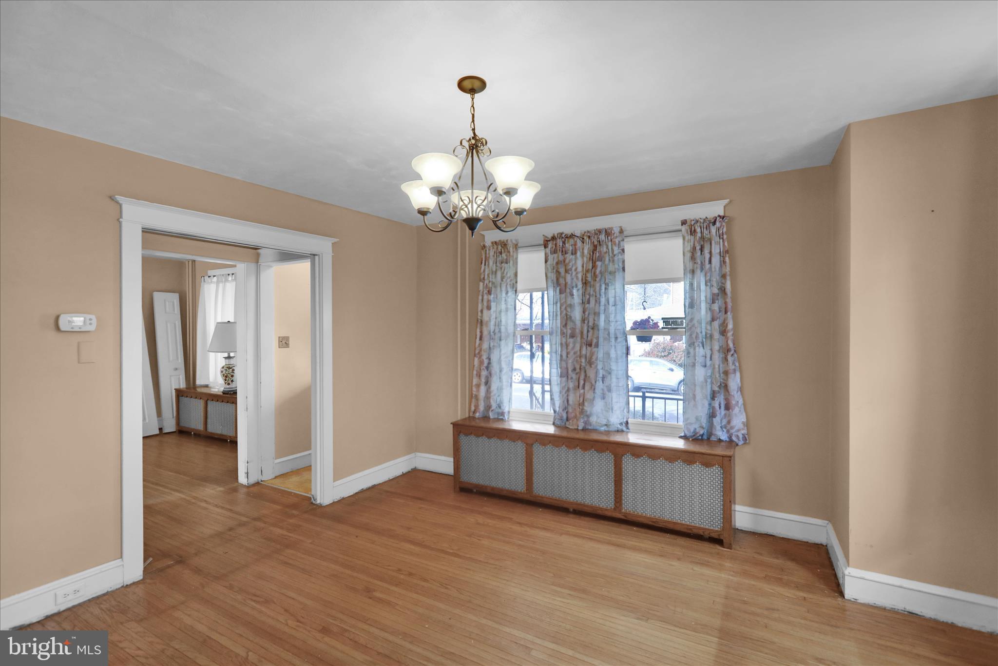 1522 Delaware Avenue Reading, PA 19610 - Photo 7 of 39 a view of an empty room with wooden floor and a window