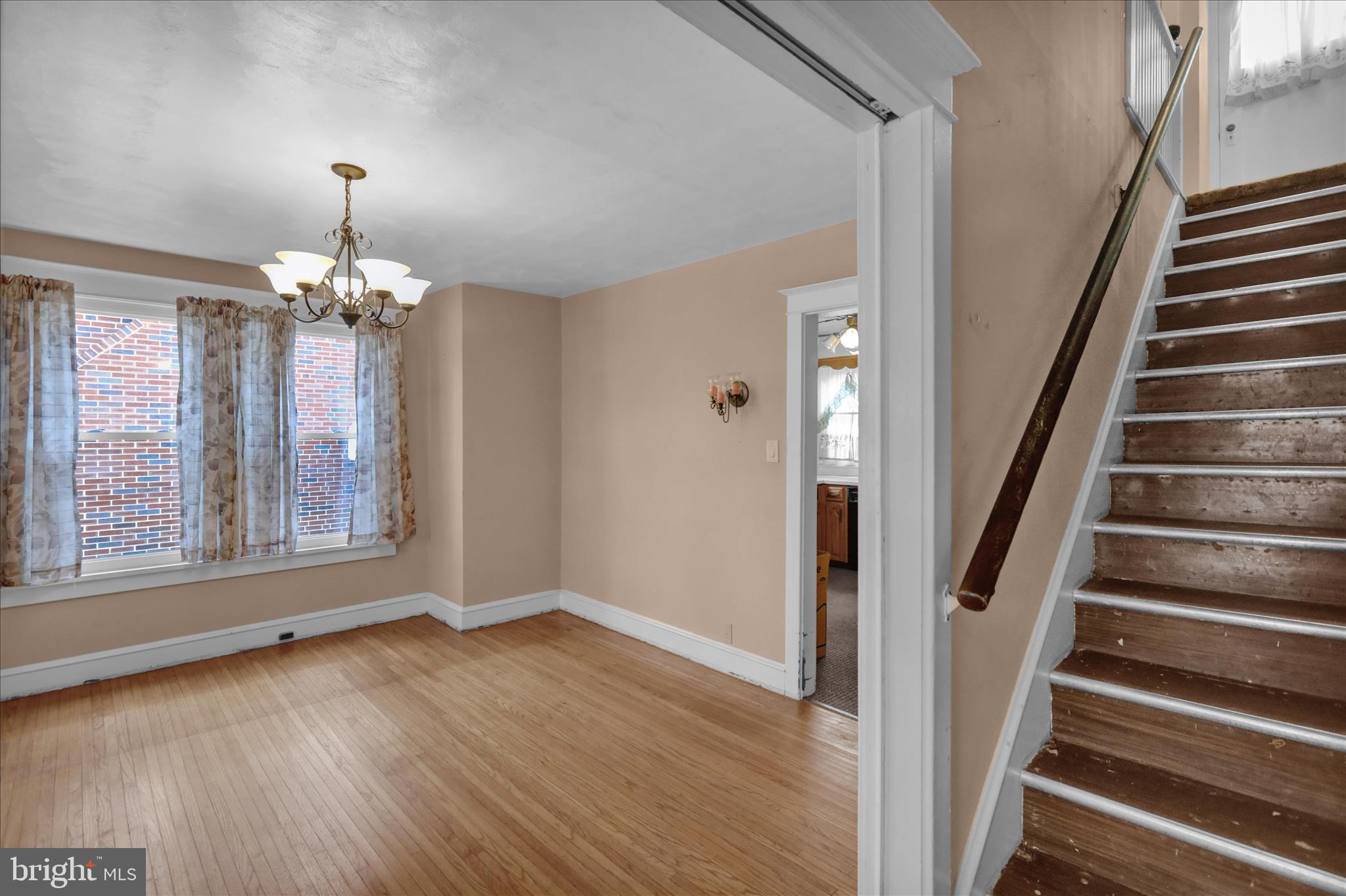 1522 Delaware Avenue Reading, PA 19610 - Photo 8 of 39 wooden floor in an empty room with a window