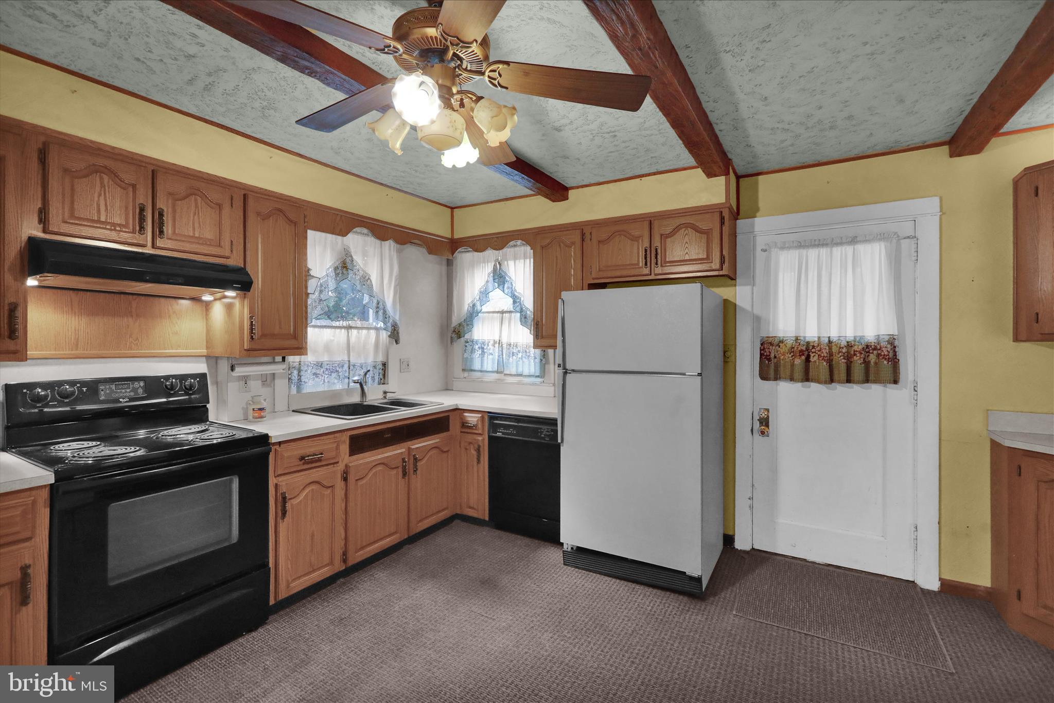 1522 Delaware Avenue Reading, PA 19610 - Photo 9 of 39 a kitchen with stainless steel appliances granite countertop a refrigerator a stove a sink and a microwave