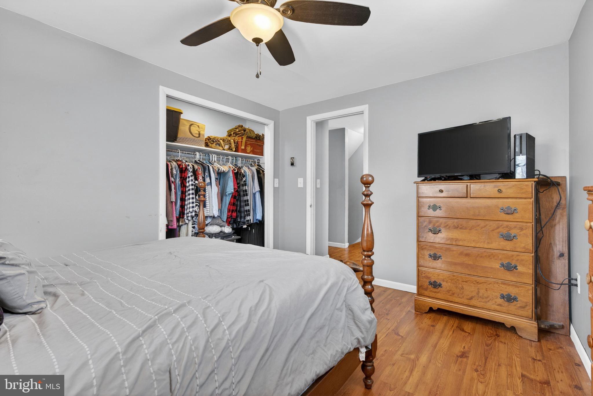 311 Fulton Street Akron, PA 17501 - Photo 16 of 30 a bedroom with a bed and a flat tv screen on dresser