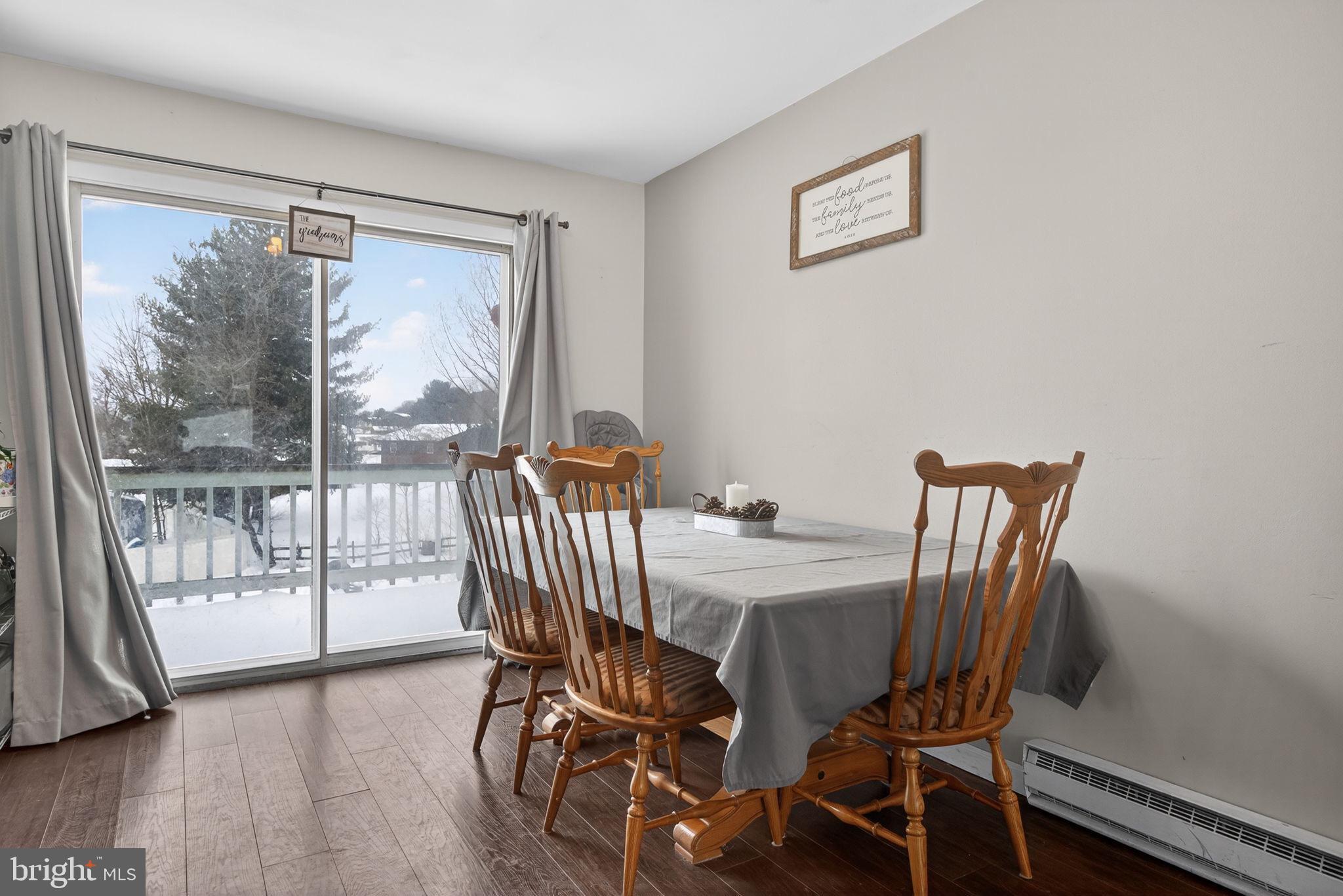 311 Fulton Street Akron, PA 17501 - Photo 9 of 30 a view of a dining room with furniture wooden floor and next to a window