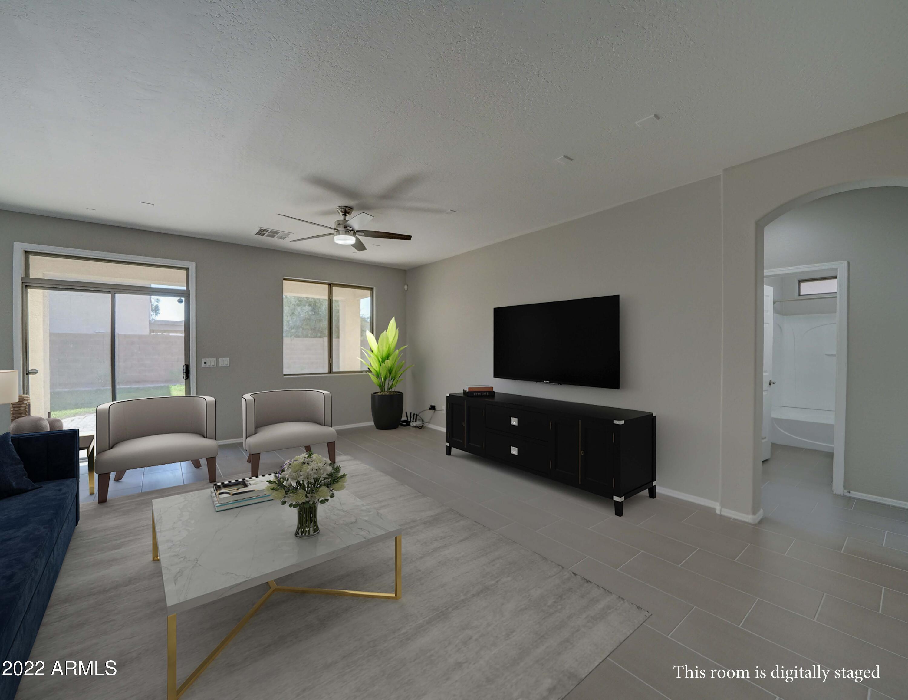 6827 West St Catherine Avenue Laveen, AZ 85339 - Photo 23 of 58 Family Room Digitally Staged
