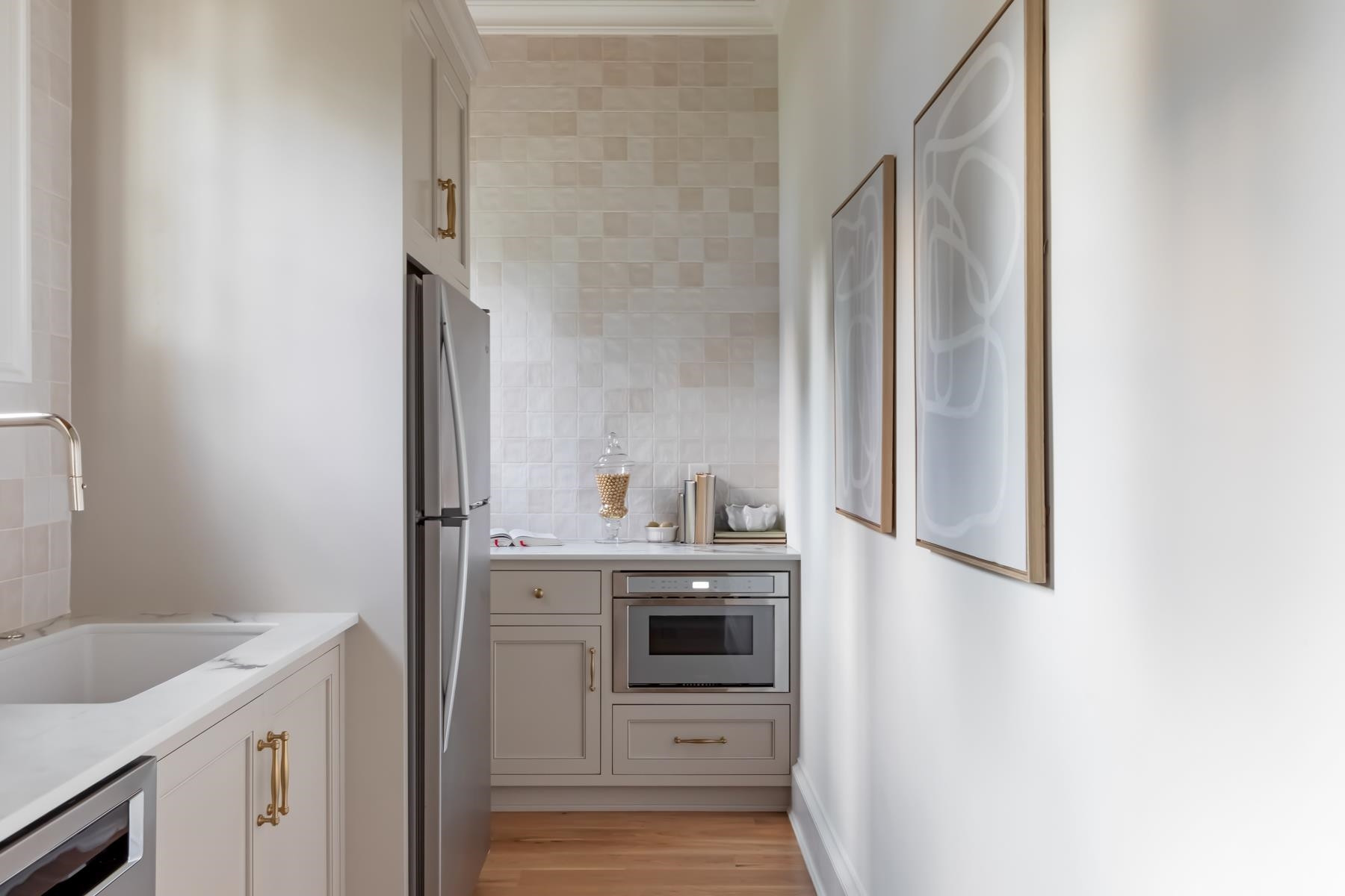 727 Lake Boone Trail Raleigh, NC 27607 - Photo 24 of 100 a kitchen with a sink cabinets and a wooden floor