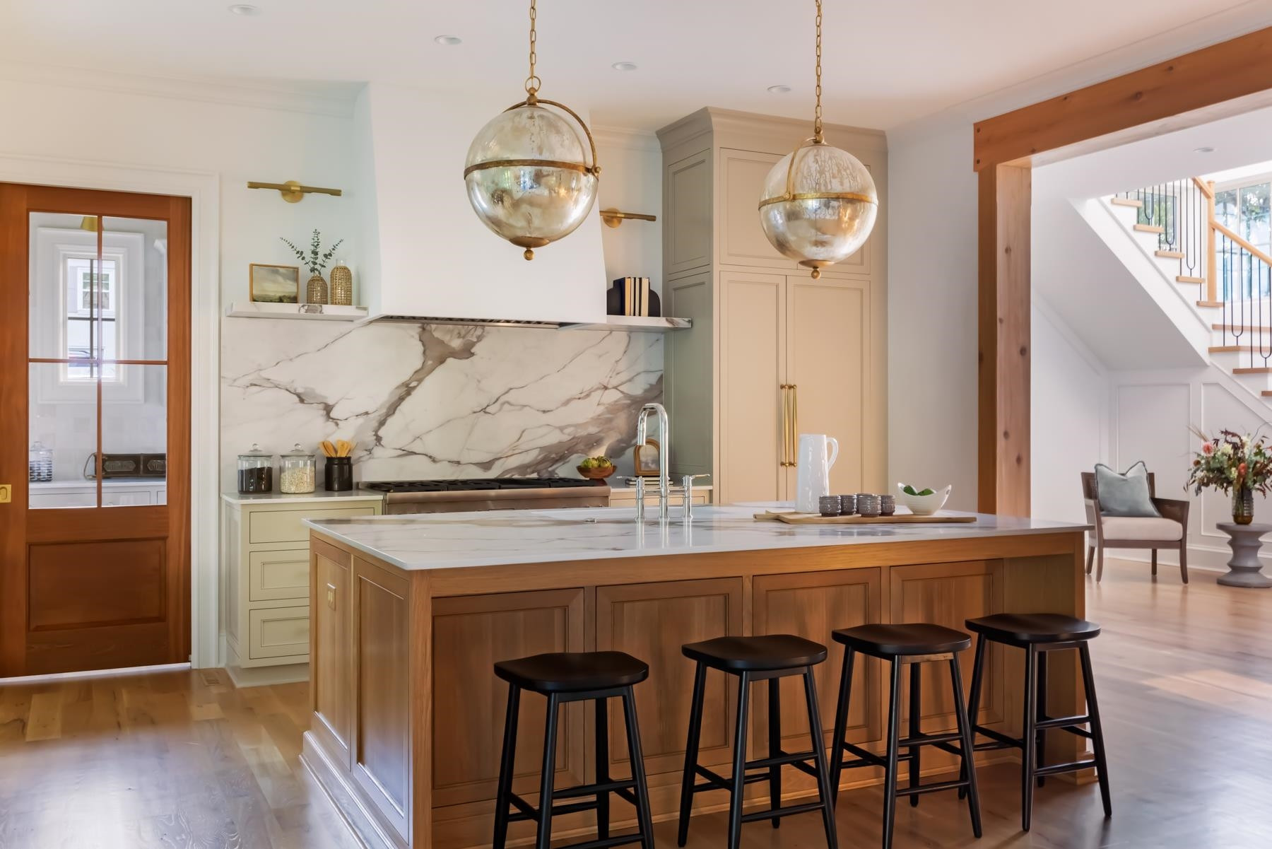 727 Lake Boone Trail Raleigh, NC 27607 - Photo 29 of 100 a dining room with wooden floor a chandelier a wooden table and chairs