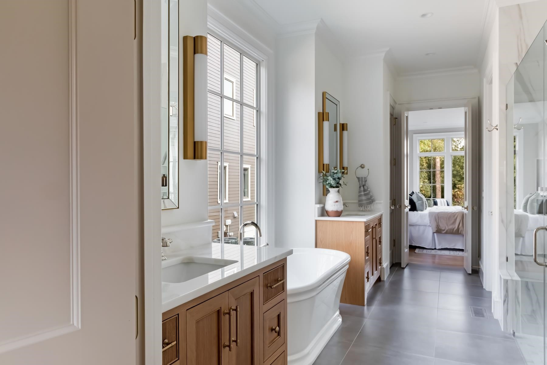 727 Lake Boone Trail Raleigh, NC 27607 - Photo 45 of 100 a en suite bathroom with a granite countertop sink a mirror and a bathtub