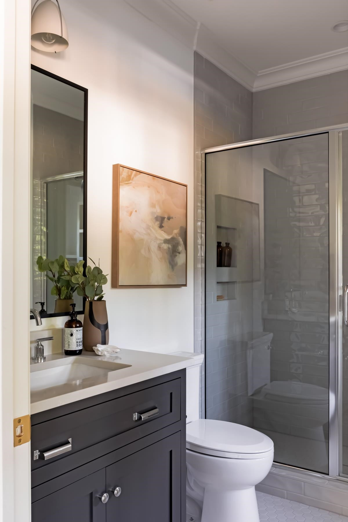 727 Lake Boone Trail Raleigh, NC 27607 - Photo 70 of 100 a bathroom with a sink a toilet a shower and a mirror