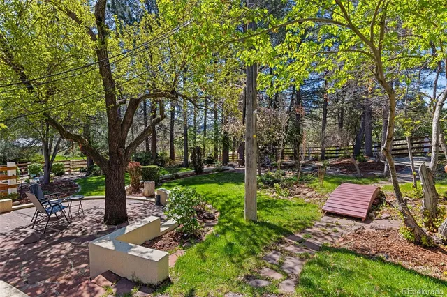 a view of backyard with sitting area