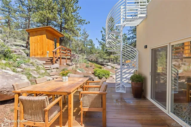 a terrace with outdoor seating and wooden floor