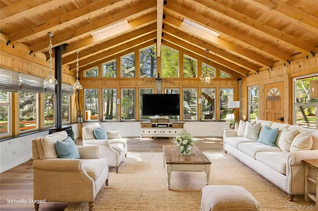 a living room with furniture or outdoor view and a large window