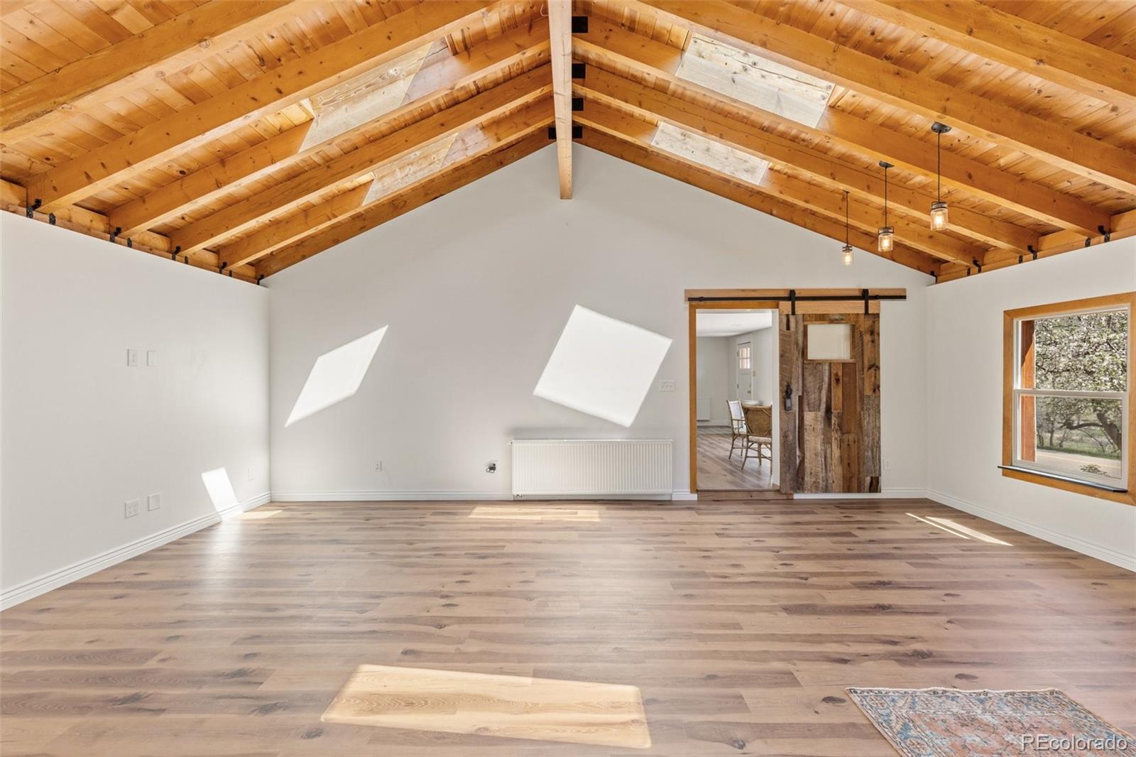 1669 Apple Valley Road Lyons, CO 80540 - Photo 27 of 48 a view of a livingroom with wooden floor