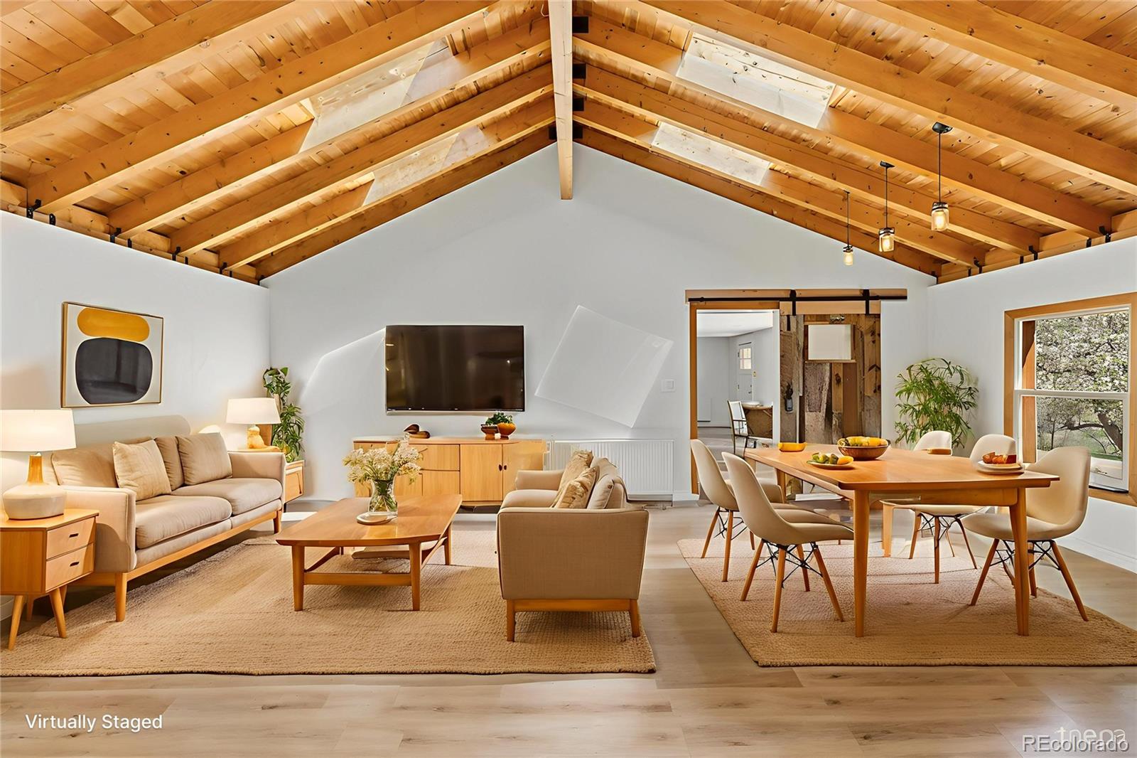 1669 Apple Valley Road Lyons, CO 80540 - Photo 28 of 48 a living room with furniture and a flat screen tv