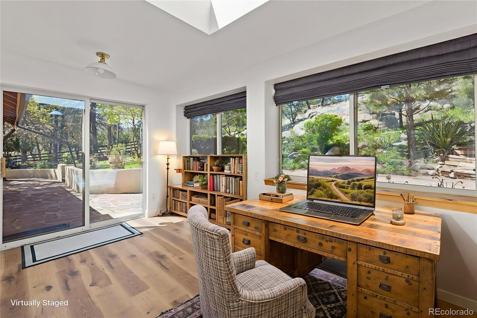 1669 Apple Valley Road Lyons, CO 80540 - Photo 31 of 48 a work room with furniture and large windows