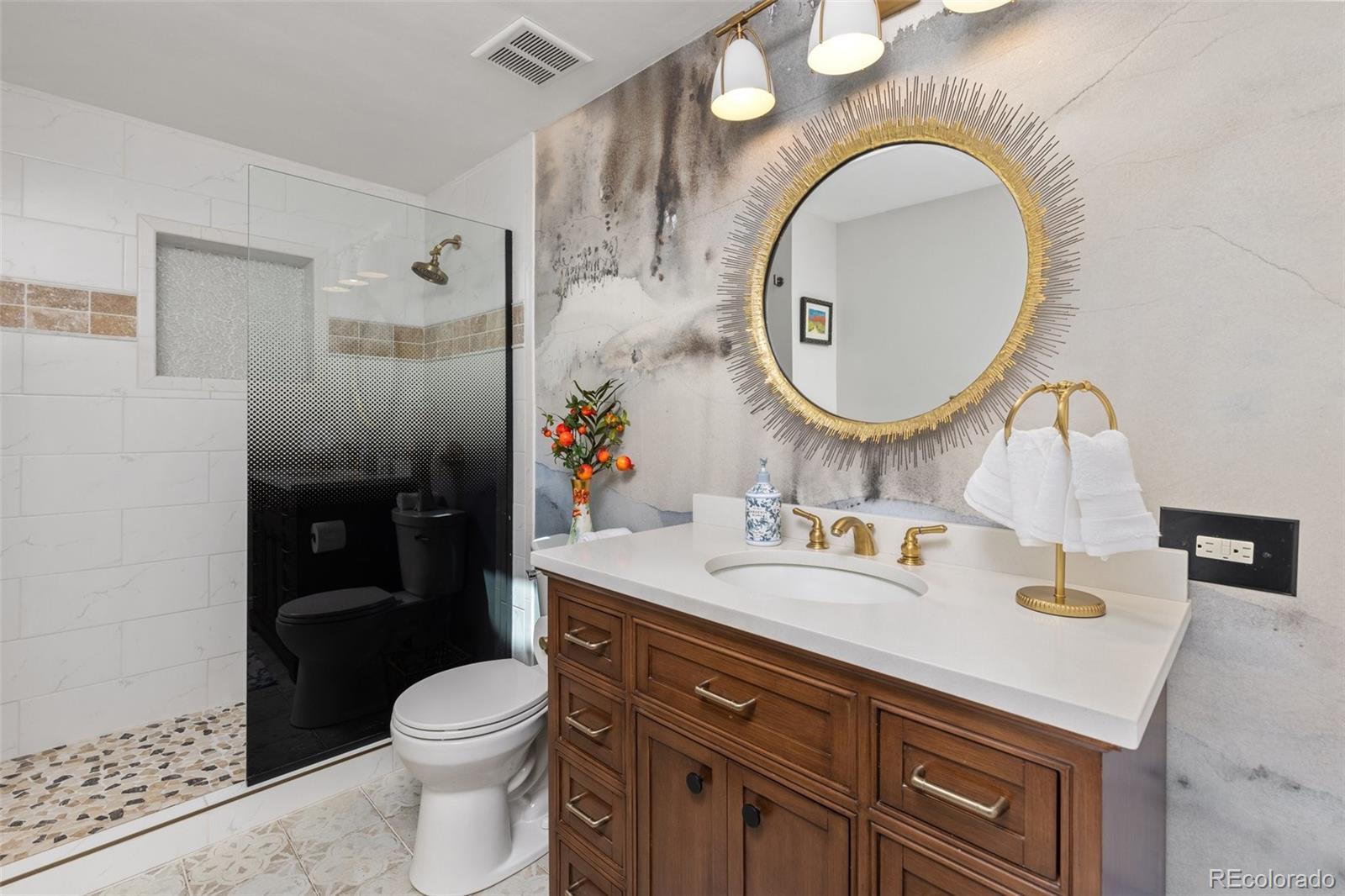 1669 Apple Valley Road Lyons, CO 80540 - Photo 32 of 48 a bathroom with a sink and a mirror