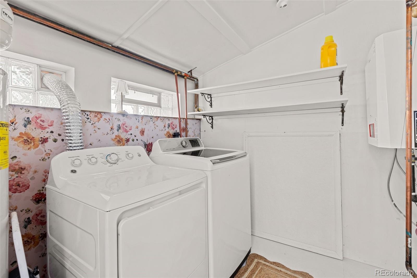 1669 Apple Valley Road Lyons, CO 80540 - Photo 33 of 48 a utility room with dryer and washer
