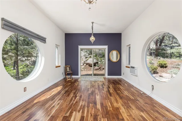 workspace with wooden floor fan and window