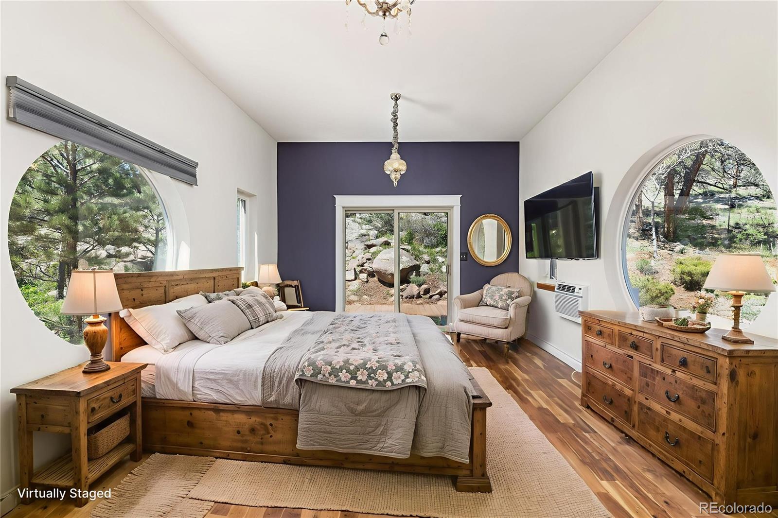 1669 Apple Valley Road Lyons, CO 80540 - Photo 35 of 48 a bedroom with a large bed and a window