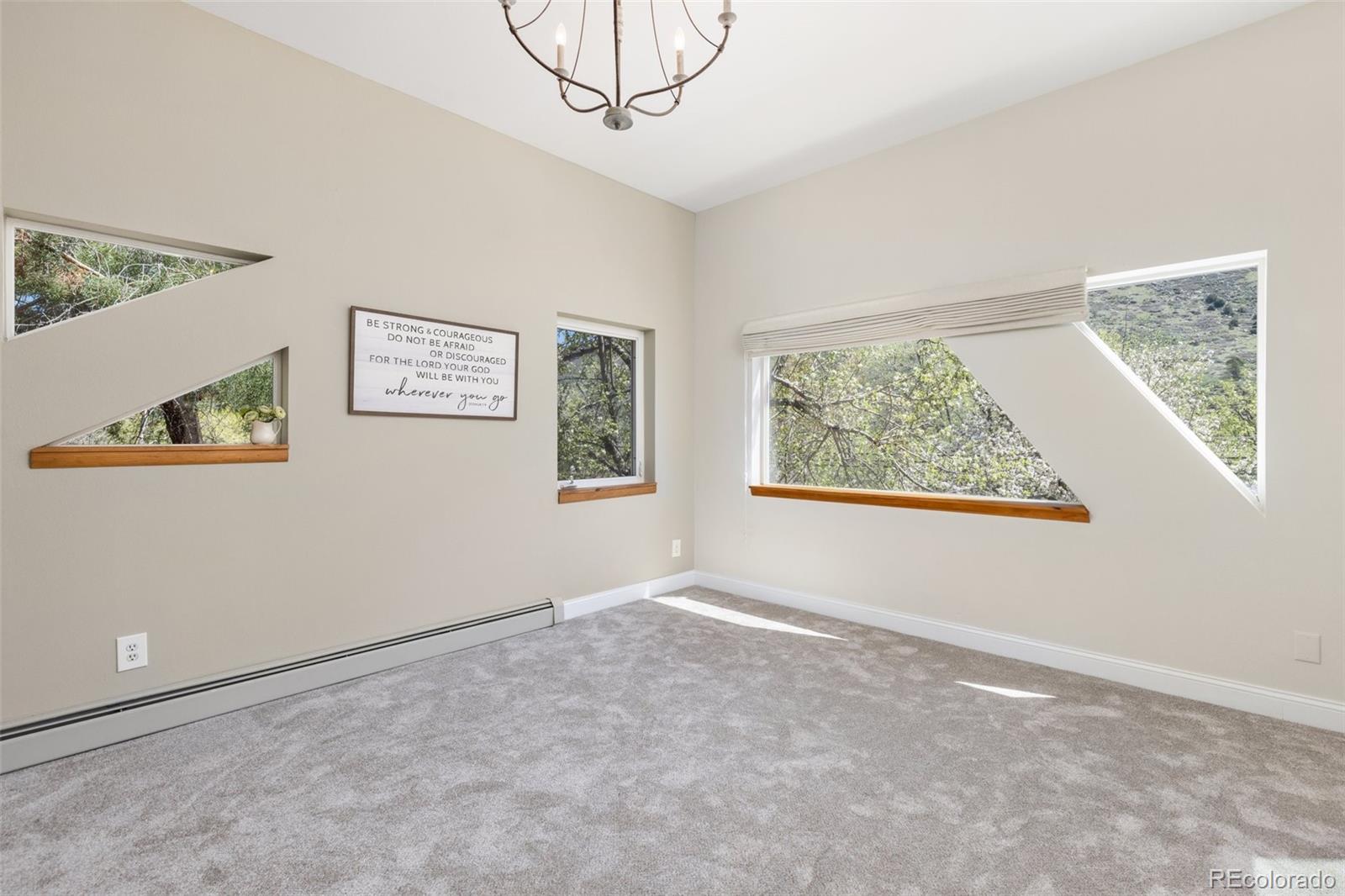 1669 Apple Valley Road Lyons, CO 80540 - Photo 38 of 48 a view of an empty room with a window