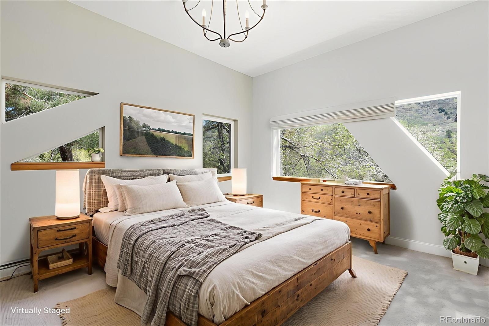 1669 Apple Valley Road Lyons, CO 80540 - Photo 39 of 48 a bedroom with a bed and a window