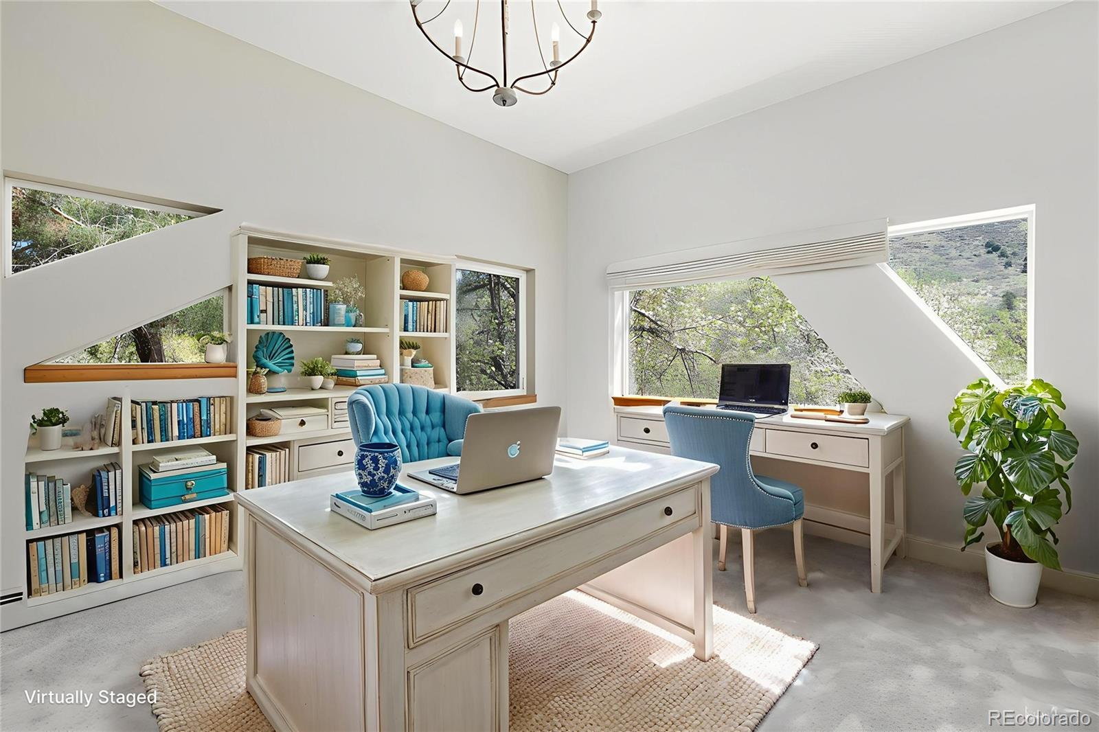 1669 Apple Valley Road Lyons, CO 80540 - Photo 40 of 48 a view of a workspace with furniture and a potted plant