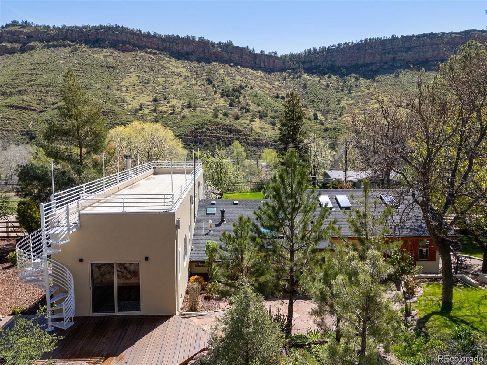 1669 Apple Valley Road Lyons, CO 80540 - Photo 4 of 48 a view of a lake with a mountain in the background