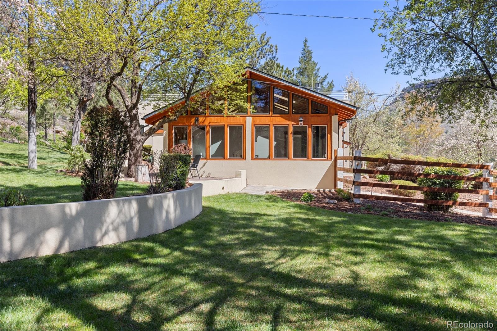 1669 Apple Valley Road Lyons, CO 80540 - Photo 7 of 48 a front view of a house with a yard