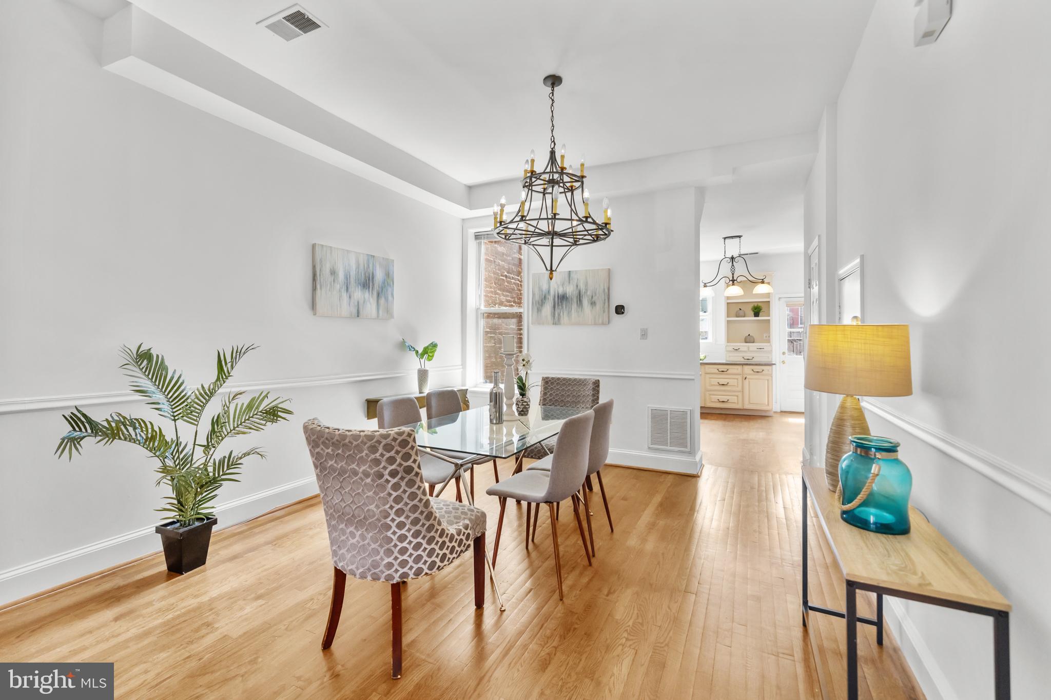 661 F Street Northeast Washington, DC 20002 - Photo 17 of 64 a view of a dining room with furniture and chandelier