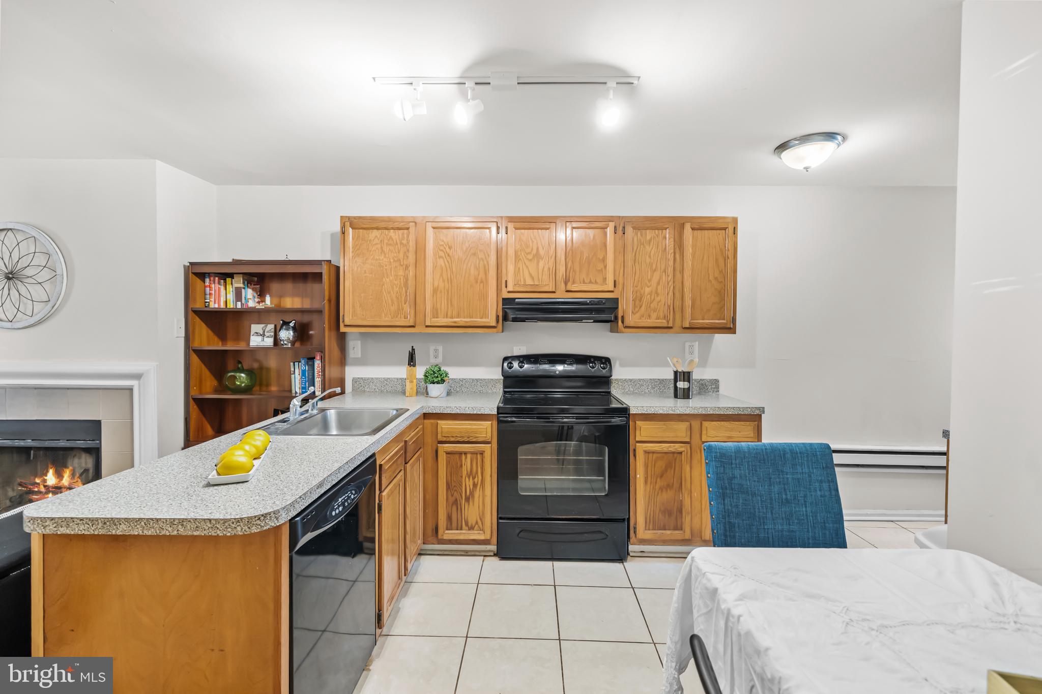 661 F Street Northeast Washington, DC 20002 - Photo 36 of 64 a kitchen with stainless steel appliances granite countertop a stove top oven a sink a counter space and cabinets