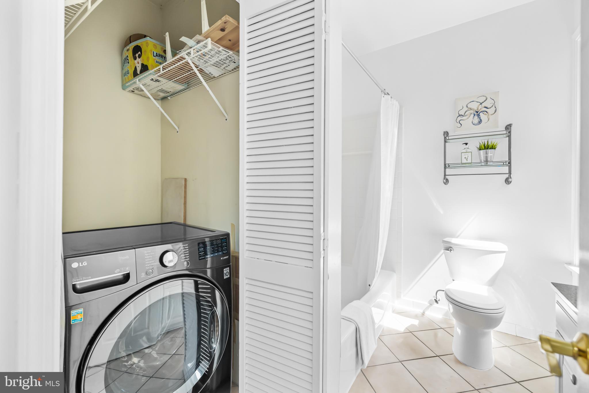 661 F Street Northeast Washington, DC 20002 - Photo 54 of 64 a bathroom with a toilet and a shower curtain